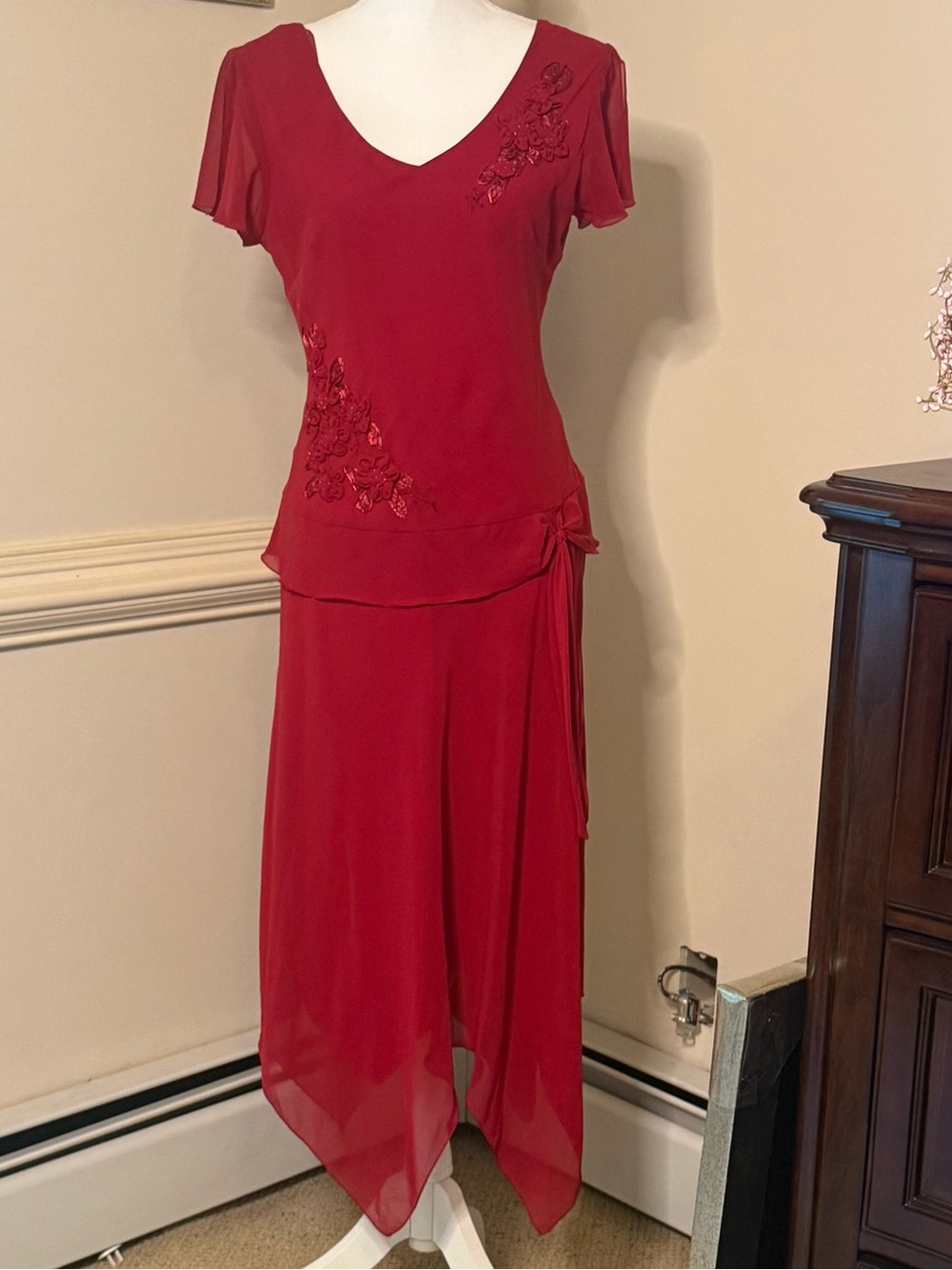 Elegant Red Asymmetrical Skirt with Floral Appliqué